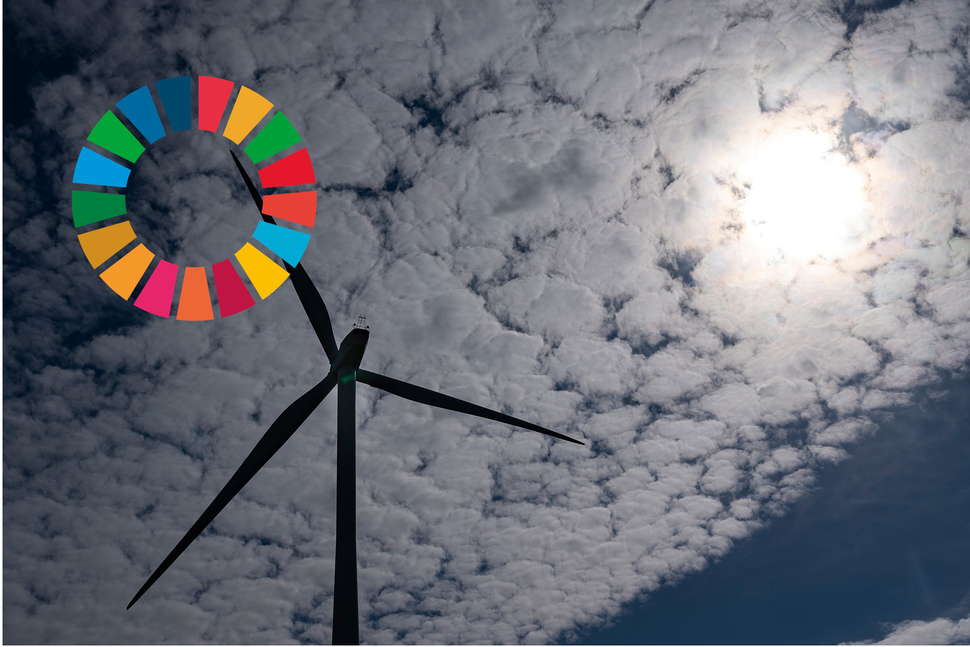 Texten "7 Hållbar energi för alla" står i vit text mot en gul bakgrund. Under texten finns en sol och mitt i solen en on/off-symbol.